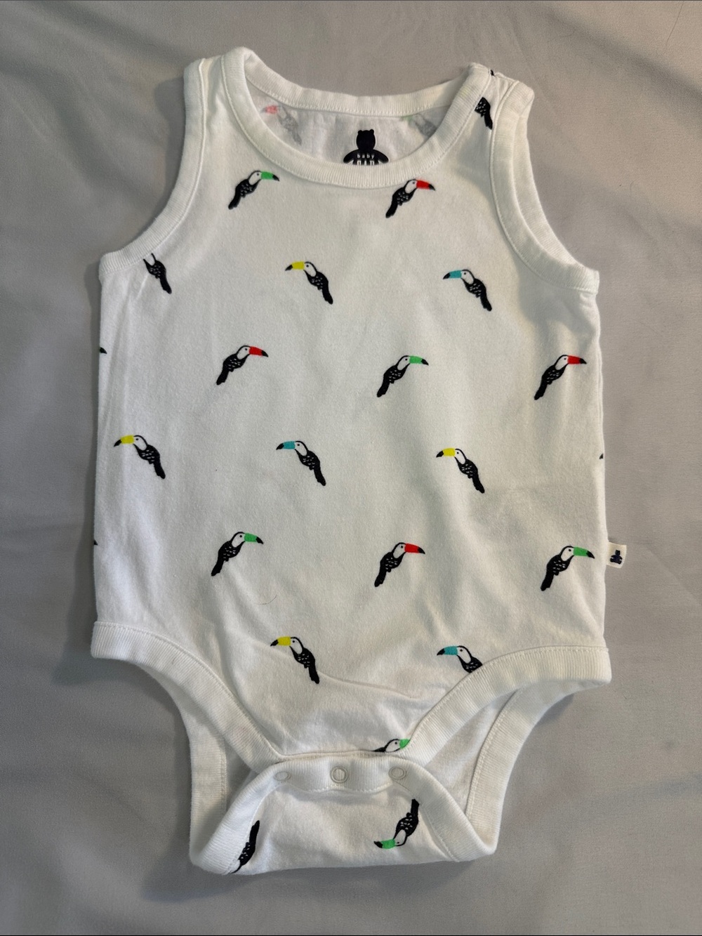GAP White Baby Onesie with Multicolored Toucan Print